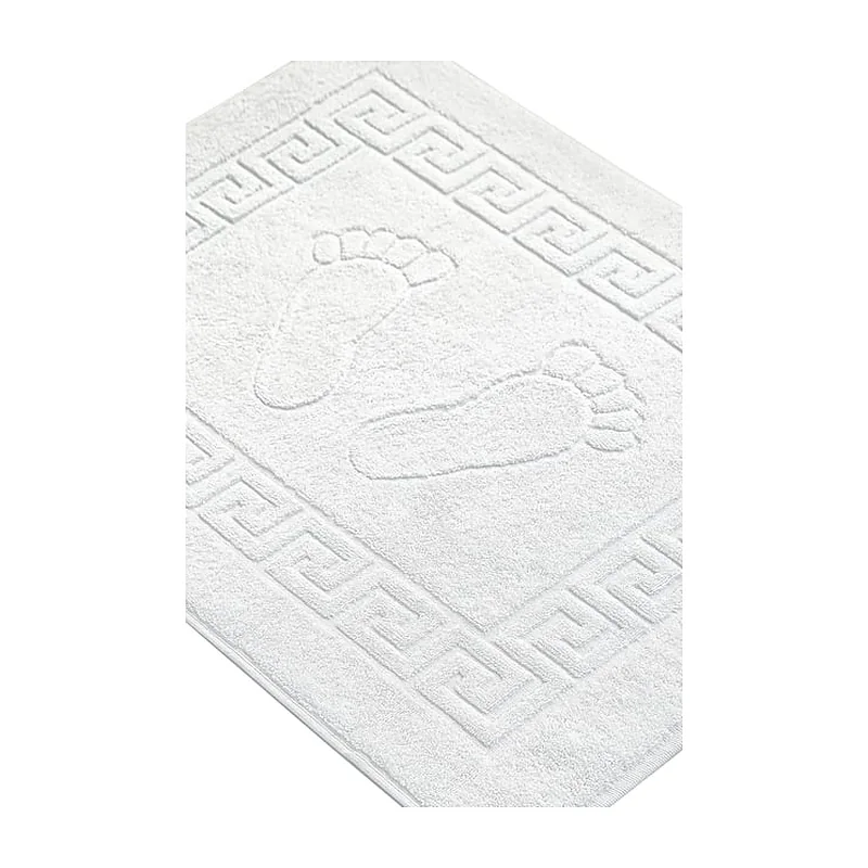 White terry bath mat with a Greek key frame and footprints