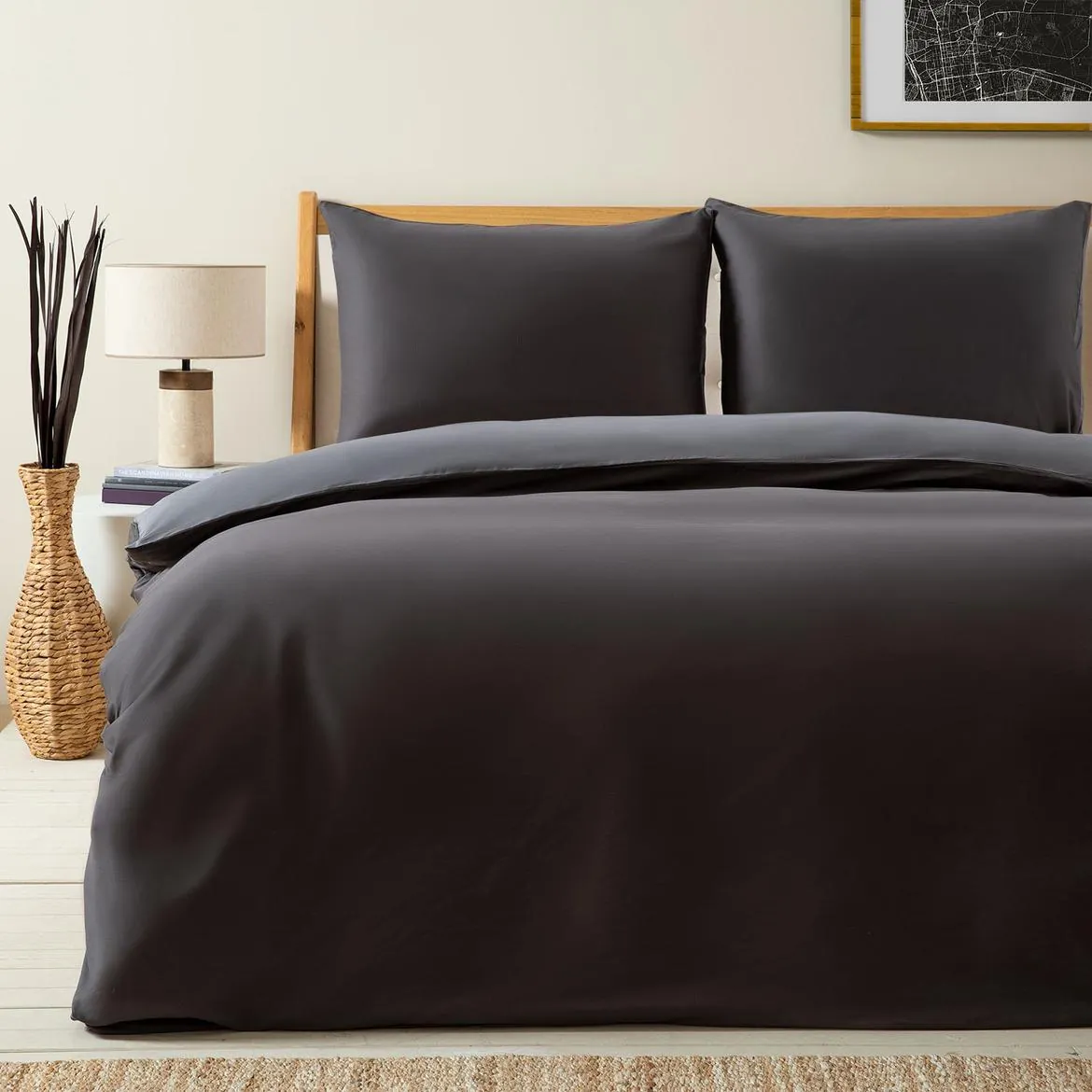 Bed dressed in an anthracite duvet cover set