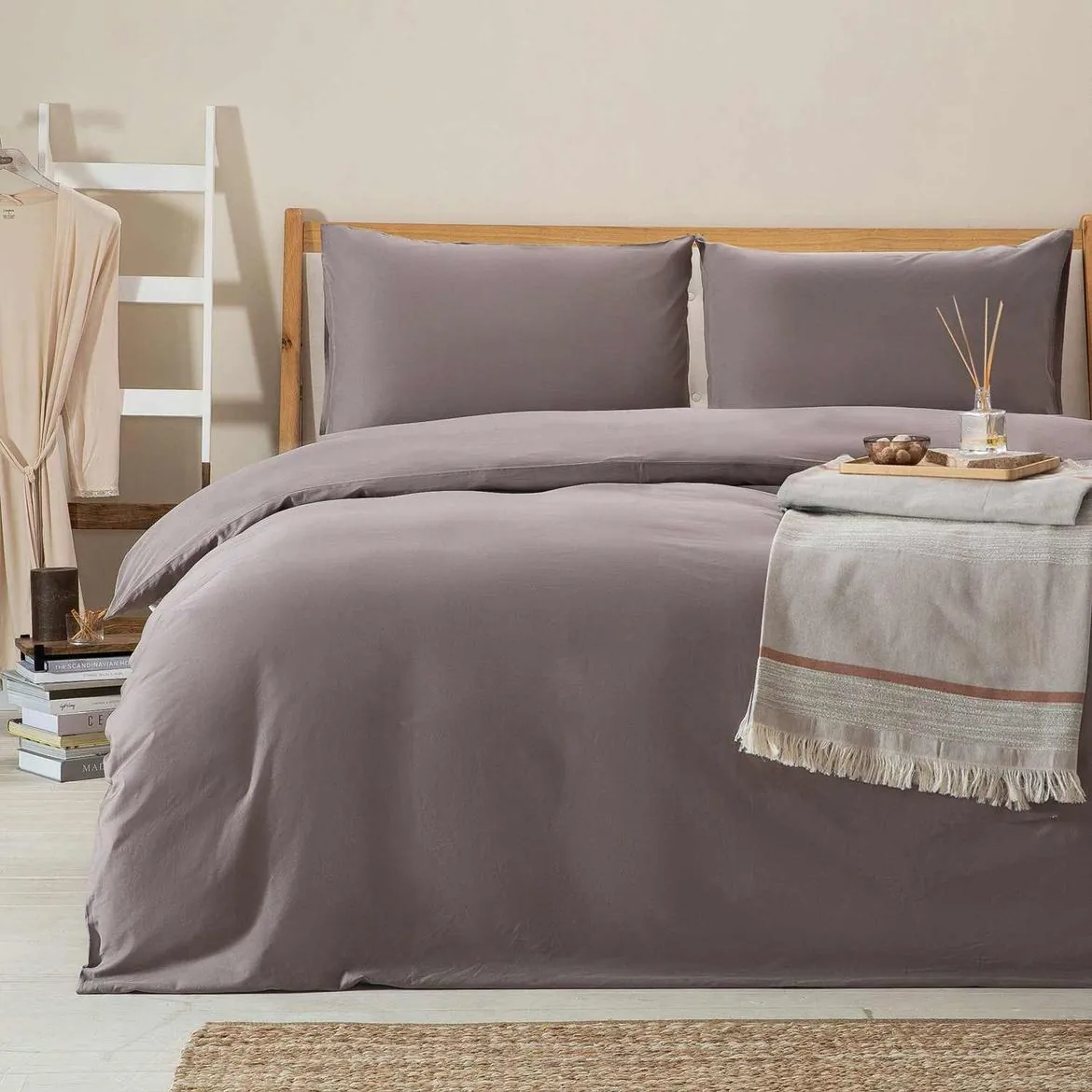 Bed dressed in a mink grey duvet cover set
