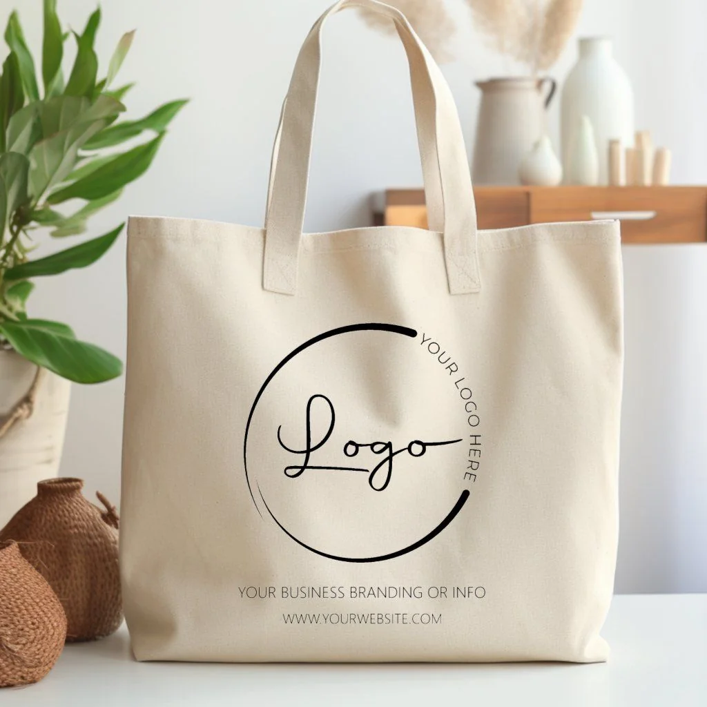 Natural canvas tote bag with a sample logo printed on the front